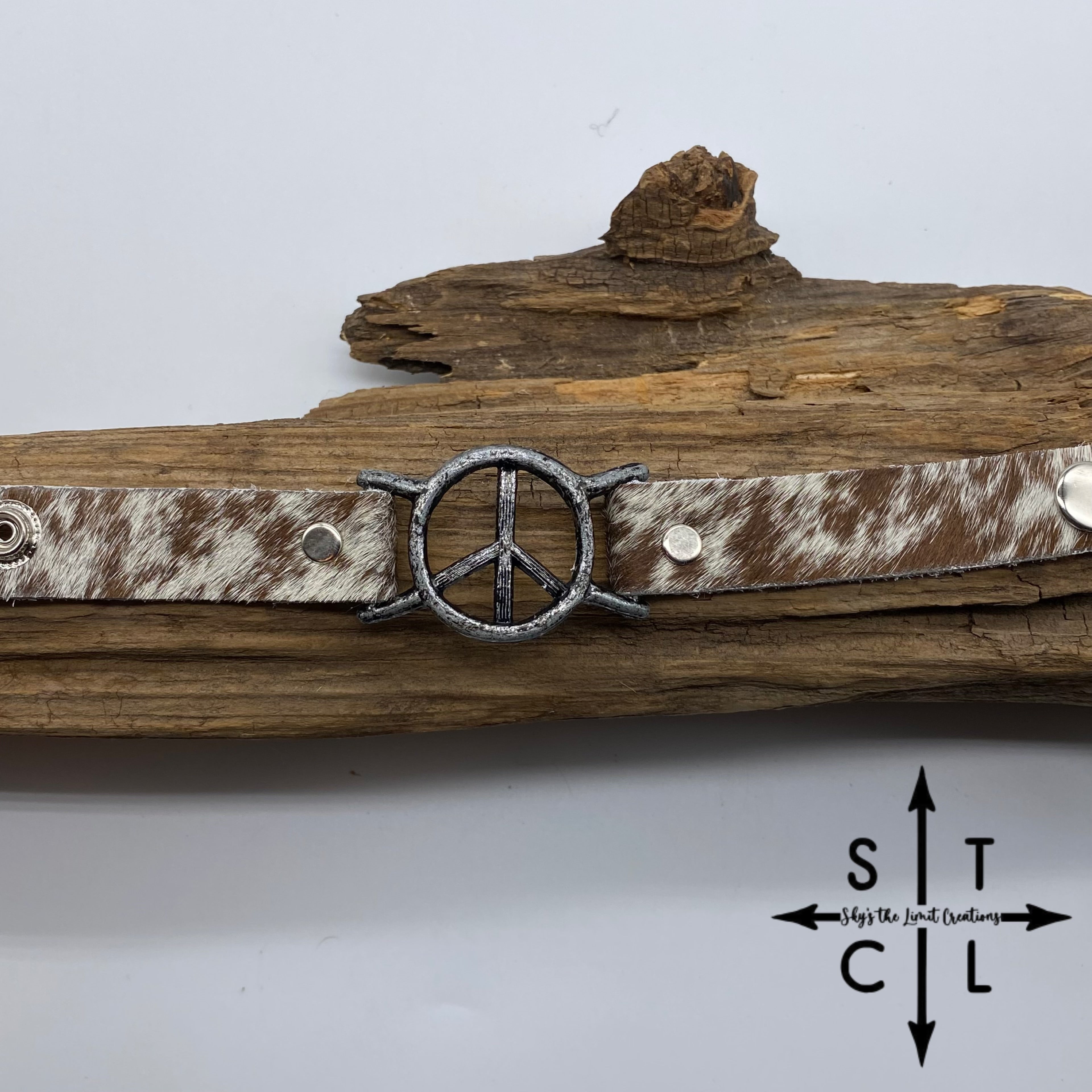 Spotted Reddish Brown and White Cowhide Peace Bracelet