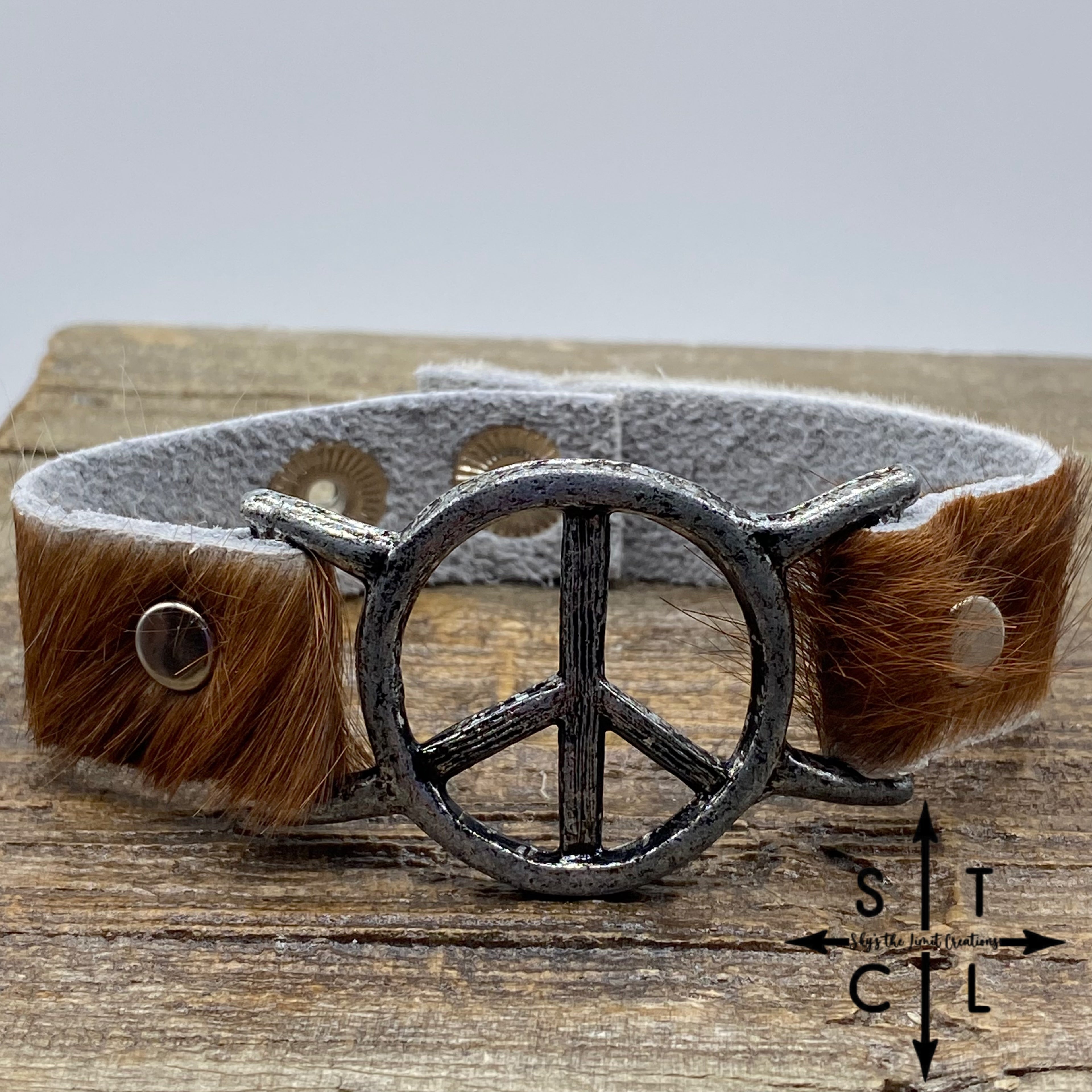 Reddish Brown and White Cowhide Peace Bracelet