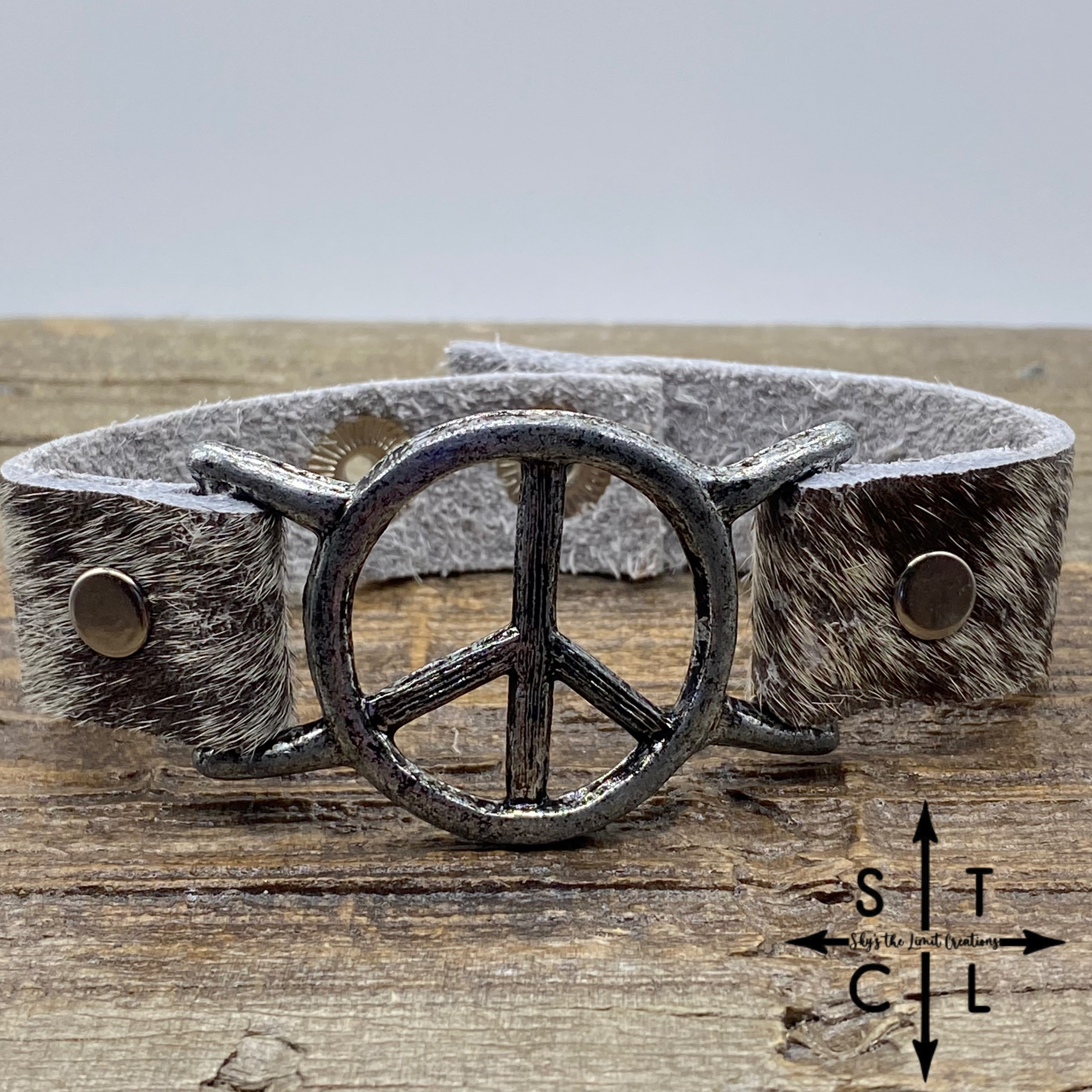 Spotted Brown and White Cowhide Peace Bracelet