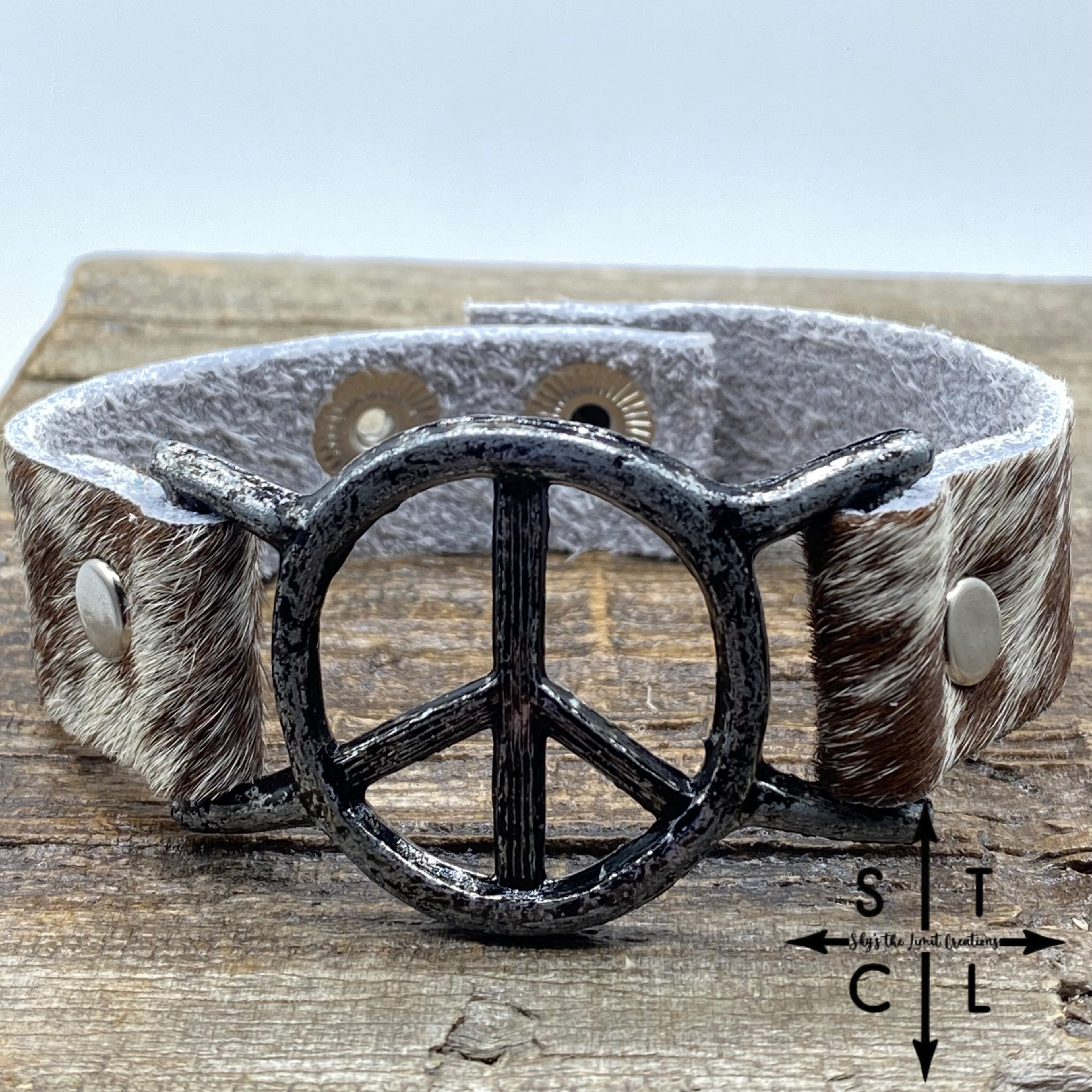 Spotted Reddish Brown and White Cowhide Peace Bracelet